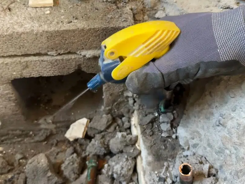 Acoustic leak sensor placed on concrete near pipe access for slab leak repair cost central homes in Stanton