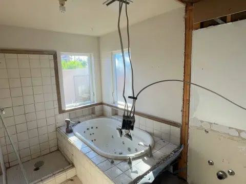 Bathroom remodel opened to studs with tub and exposed framing for index in Stanton for thumb loc katella corridor 001