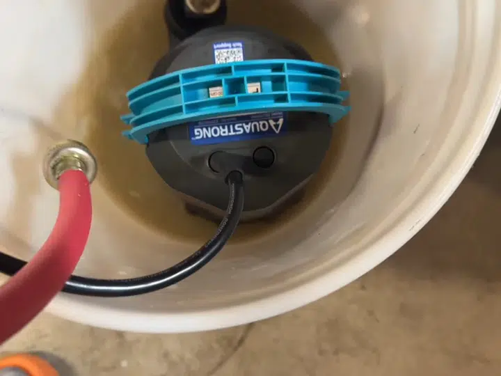 Garbage disposal bottom with electrical connection visible for garbage disposal in Stanton