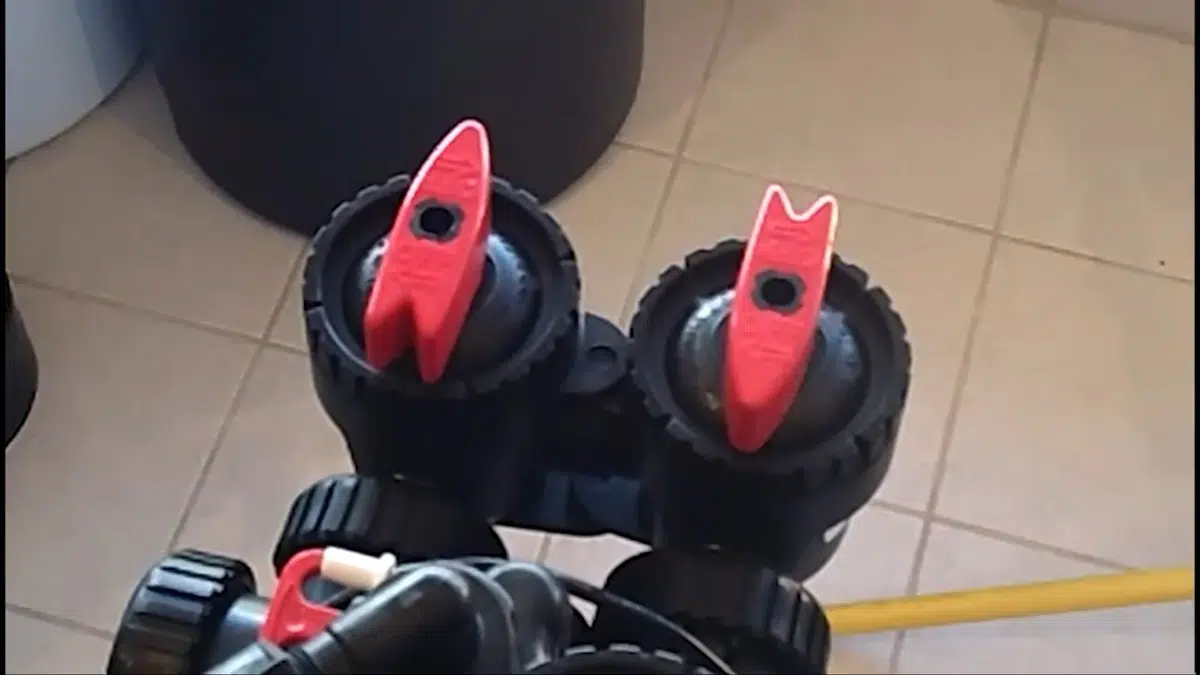 Two drain cable machine handles on tile floor for drain cleaning vs hydro jetting when to choose in Stanton