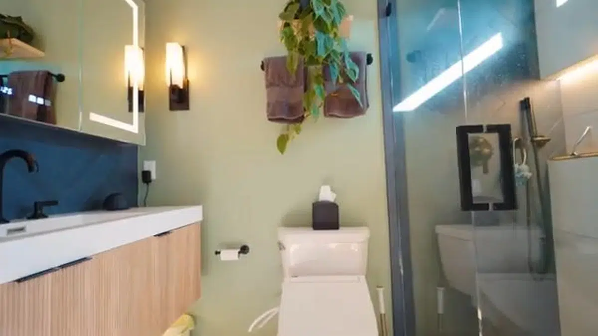 Finished remodeled bathroom with glass shower and vanity for shower bathtub installation in Stanton