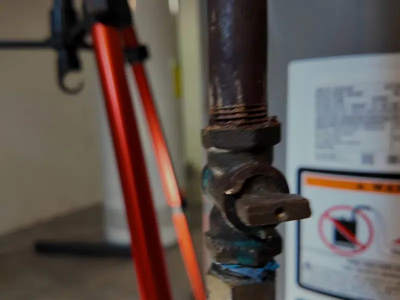 Burner area and gas valve on water heater for water heater repair in Stanton