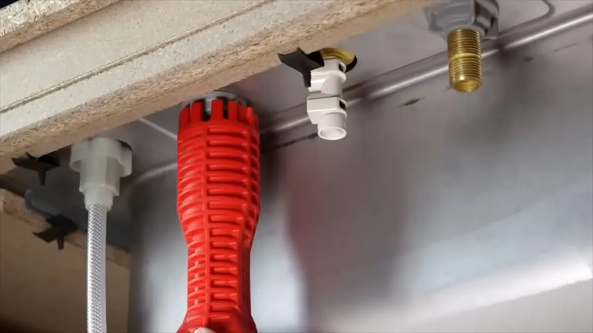 Red corrugated sleeve and pipe connections below fixture for what to do burst pipe stanton emergency guide in Stanton