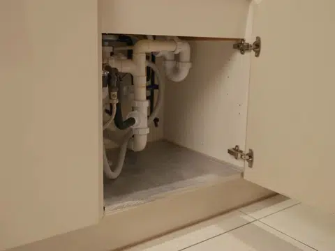 Sink and faucet plumbing repair under cabinet for index in Stanton shown from a different service angle